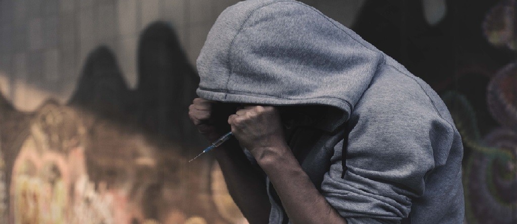 Guy holding injection